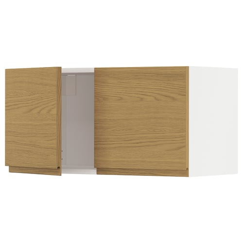 A wooden kitchen cabinet with a minimalist design in oak color. The cabinet has one open section revealing an inner compartment.