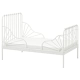 The MINNEN bed is a white, metal toddler bed with a classic, elegant shape and curved spindles. Its extendable and made of durable steel.