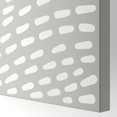 Close-up view of a modern grey door with evenly spaced circular cutouts, showcasing its sleek and minimalist design.