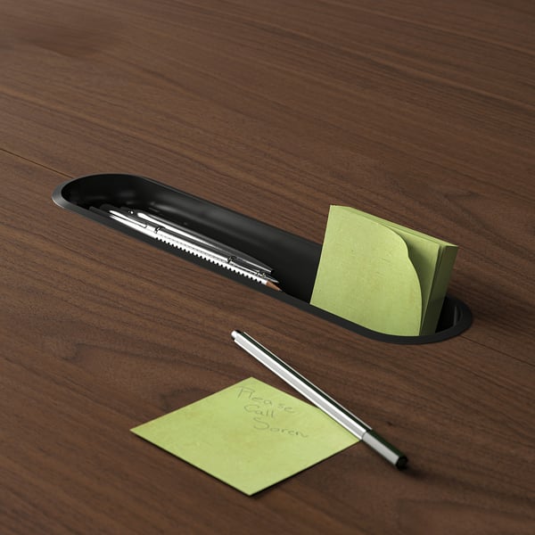 Wooden conference table with a built-in tray for pens and sticky notes.