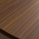 Richly stained wooden tabletop showcasing smooth, even grain patterns; beautifully crafted for a professional setting.