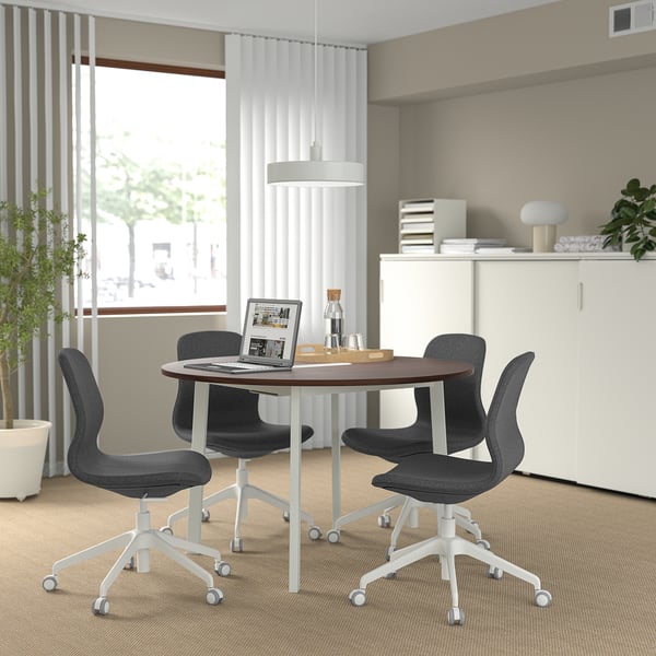 MITTZON round conference table with 4 black chairs. Walnut top, metal legs, compact for small meetings.