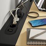 Desk with integrated power module, usb charging, and cable management.