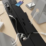 Desk with built-in power socket and cable management tray, keeping workspace organized and clutter-free.