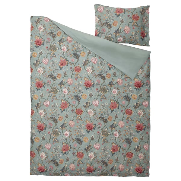 Green NÄSSELKLOCKA duvet set with colorful floral pattern.