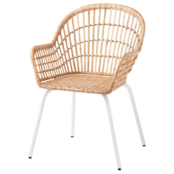 A NILSOVE chair in light beige with white legs, hand-woven rattan, and bamboo design for a natural, airy look.
