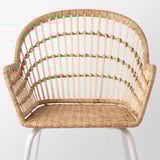 Wicker chair, handwoven rattan, sturdy bamboo, curved back, detailed pattern, light, natural, unique.
