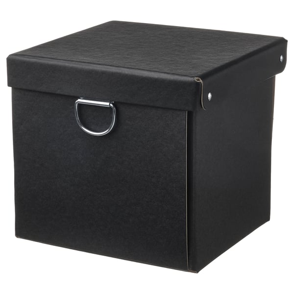 A black, square NIMM storage box with a lid and metal handle. Make of recycled paperboard.