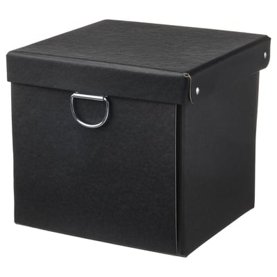 A black, square NIMM storage box with a lid and metal handle. Make of recycled paperboard.