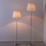 Two NYFORS floor lamps with adjustable heights and fabric shades.