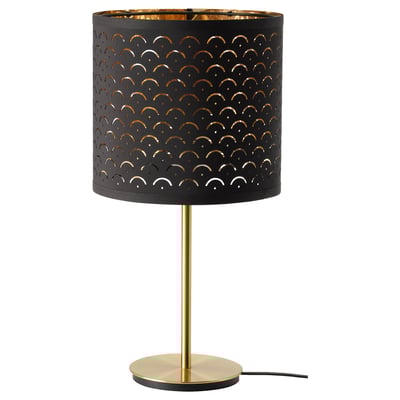 NYMÖ lamp, gold and black. Perforated shade casts light pattern. Round base, sleek design.