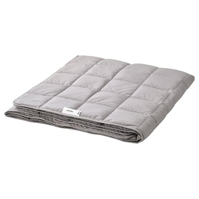 Grey ODONVIDE weighted blanket, folded with box-stitch design and recycled materials.