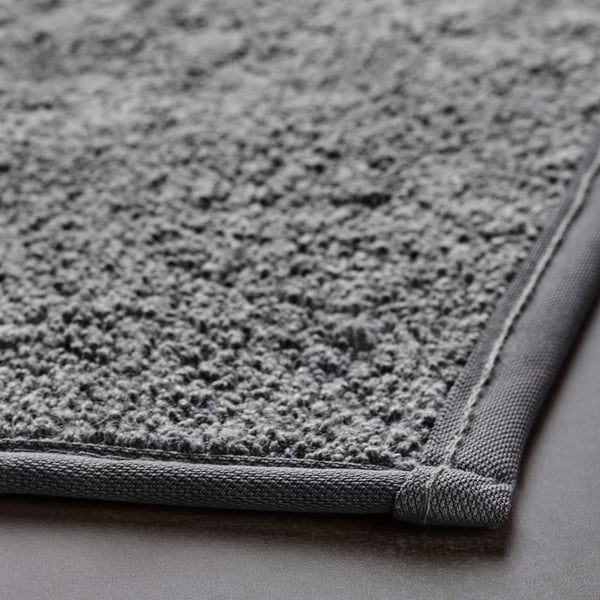 Close-up of a plush, sustainable bath mat with a soft, textured surface and sturdy edges.