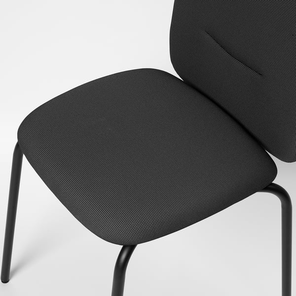 Close-up of modern chair with sleek black metal legs, thick dark fabric seat, and high backrest, showcasing comfort and quality.