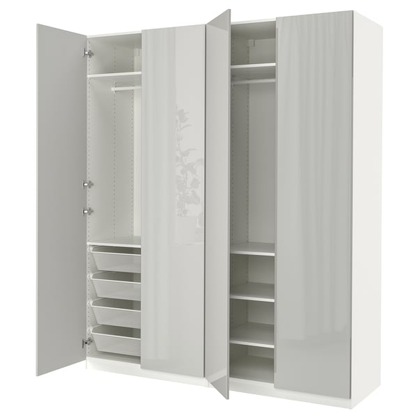 This image shows a white PAX wardrobe with open doors revealing storage sections and mesh baskets inside.