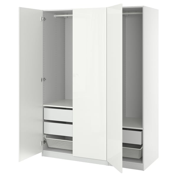 White PAX wardrobe with open doors, showing shelves, drawers, and mesh baskets.