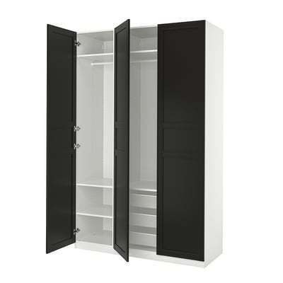An open black and white ikea PAX wardrobe with shelves and a hanging rail. Its modern, rectangular, and has both drawers and hanging space.