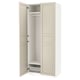 White PAX wardrobe with beige doors, adjustable shelves, and soft-closing hinges.