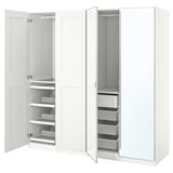 White PAX wardrobe with open doors, shelves, drawers, and mesh storage.
