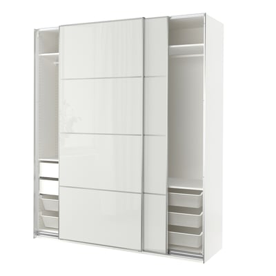 White PAX wardrobe with mirrored sliding doors, containing shelves and mesh drawers, offers modern storage.