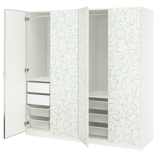 A white PAX wardrobe with floral-patterned doors, featuring multiple shelves and drawers inside for storage.