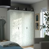 Large ikea PAX wardrobe with floral design, tall, three sections, silver handles.