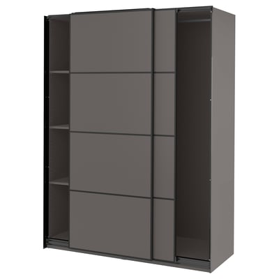 A modern dark gray sliding wardrobe named PAX. It sleek, minimalist design with two sliding doors and multiple shelves inside.