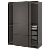 A dark grey ikea PAX wardrobe with sliding doors and shelves inside.