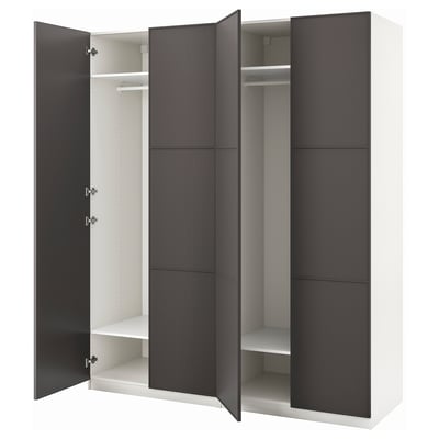 An open white and dark gray PAX wardrobe with sliding doors, revealing hangers and shelves inside.