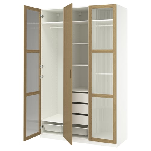 White PAX wardrobe with oak trim, glass doors open, showing shelves and drawers.