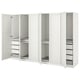 White ikea PAX wardrobe with open doors showcasing shelves and organizers inside.