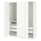 White PAX wardrobe with open doors, multiple drawers, and shelves. Modern design with sleek edges.