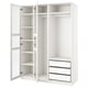 White PAX wardrobe, open doors revealing multiple shelves and a drawer section, clean and modern design.