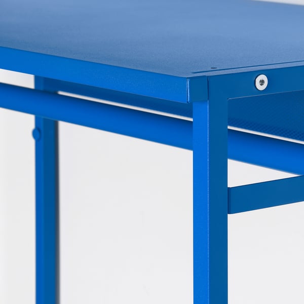 Bright blue PLATSA storage unit, sleek design, robust build. Sturdy metal construction, smooth tabletop, modern and playful.