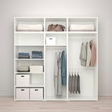 Modern closet system with shelves, hanging rods, and accessories storage.