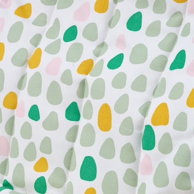 Vibrant, plush cushion with multicolored dots. Soft, durable fabric ensures comfort. Ideal for cozy, safe seating.