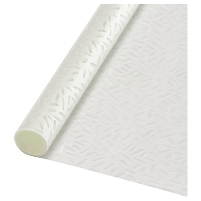 A roll of PUCKELFLY white window film. It has an embossed pattern for privacy. The roll is cylindrical with a light green core.