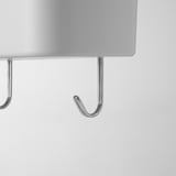 A close-up of a chrome-finished hook on a metal rack, showcasing its sturdy, polished design.
