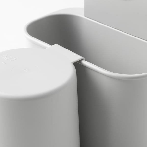 Modern, sturdy toothbrush holder with smooth, seamless design, featuring tight suction cups for secure mounting.