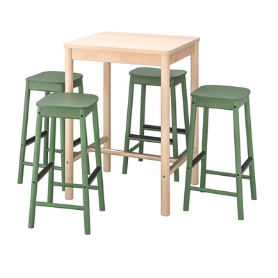 A light wooden bar table and three green bar stools with light wooden legs.