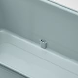 Image shows a sleek, light blue flower box with adjustable water drainage for healthy plants.