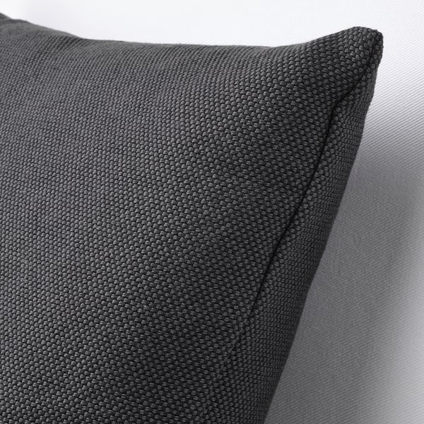 A close-up of a grey cushion with a textured cotton surface, showcasing its high-quality material and plump shape.
