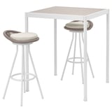 A white SEGERÖN outdoor bar set with a square table and two high stools, all in white with woven seats and light beige cushions.
