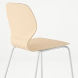 Light wooden chair with sleek design, curved backrest, and white metal legs, highlighting comfort and quality.