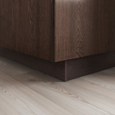 Dark wood cabinet with sleek, black plinth base, giving a modern look.
