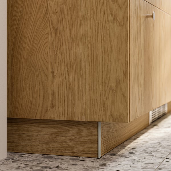 SINARP oak plinth fills gap between cabinet and floor, modern design.