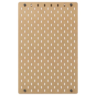 An ikea SKÅDIS beige pegboard with uniformly spaced holes for hanging accessories. It serves as versatile storage for various rooms.