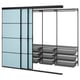The SKYTTA closet organizer blue glass doors, mesh baskets, and black metal frame.