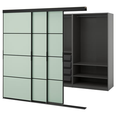 Modern black wardrobe with green-tinted glass doors, sliding design, sleek and minimalist.