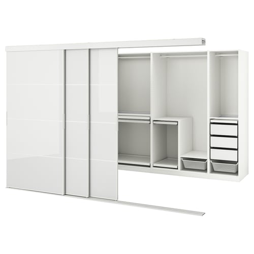 SKYTTA white wardrobe w/mirror doors. Aluminium frames enclose organiser shelves, drawers, and hangers. Minimalist, modern.